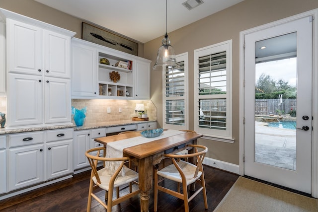 dining area featuring dark hardwood / wood-style floors