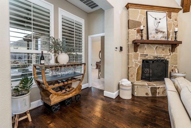 interior space with hardwood / wood-style floors and a fireplace