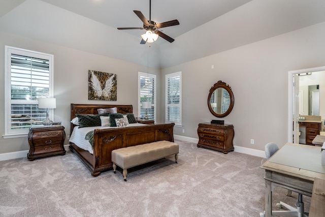 bedroom featuring ceiling fan, light colored carpet, lofted ceiling, and multiple windows