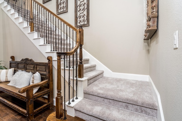 stairway with wood-type flooring