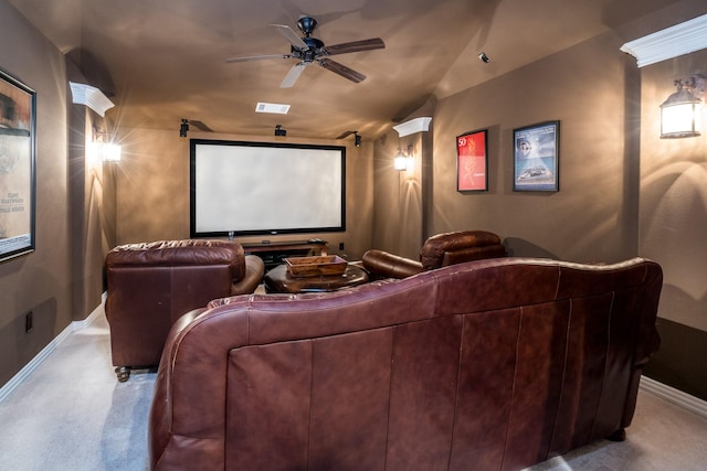 home theater with ceiling fan, light colored carpet, and lofted ceiling