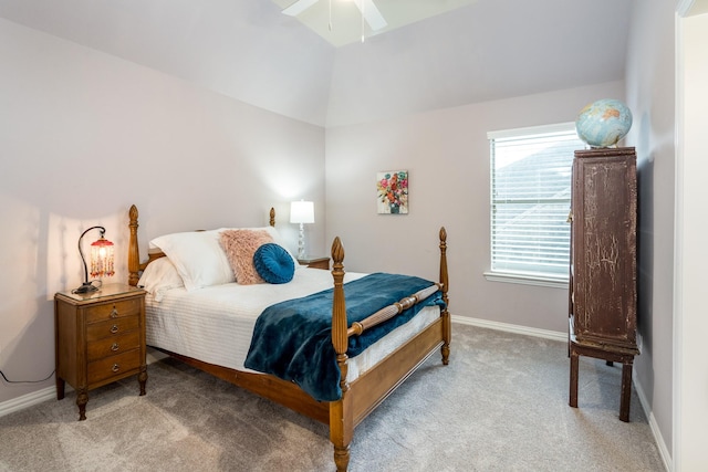 bedroom with vaulted ceiling, light colored carpet, and ceiling fan