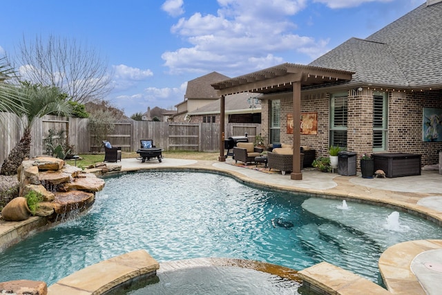 view of swimming pool with pool water feature, an outdoor living space, and a patio area