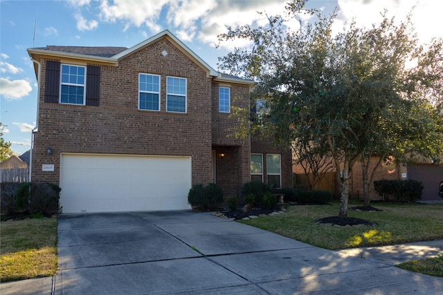 front facade with a garage and a front lawn