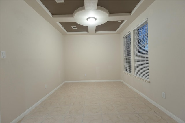 spare room with coffered ceiling