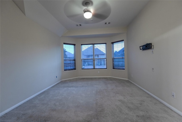 carpeted empty room featuring ceiling fan