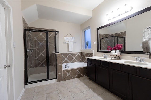 bathroom featuring tile patterned flooring, vanity, and separate shower and tub