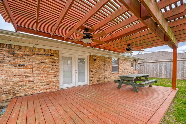 wooden terrace with french doors, a pergola, and ceiling fan