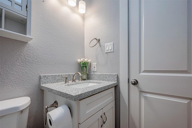 bathroom featuring sink and toilet