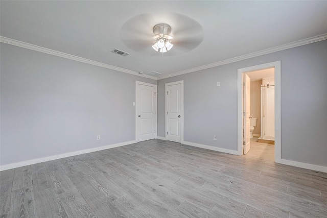 empty room with ornamental molding, ceiling fan, and light hardwood / wood-style flooring