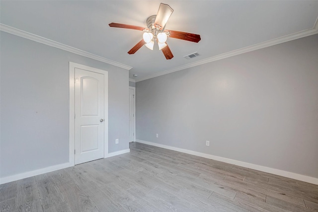 spare room featuring crown molding, ceiling fan, and light hardwood / wood-style flooring