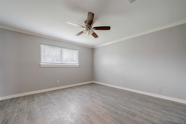 empty room featuring ceiling fan, light hardwood / wood-style floors, and crown molding