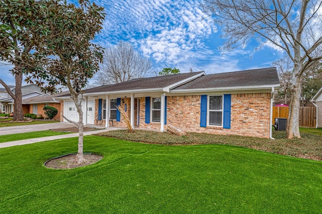 ranch-style house with central AC, a porch, a front lawn, and a garage