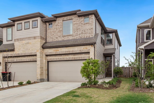 view of front of home featuring a garage and a front yard