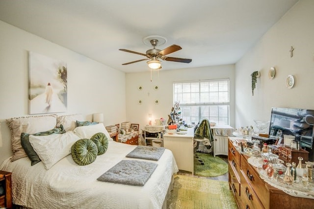 bedroom featuring ceiling fan and radiator heating unit