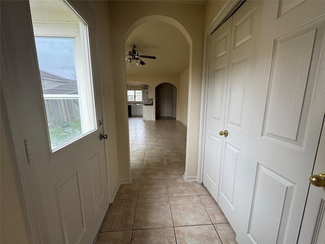 hallway featuring light tile patterned floors