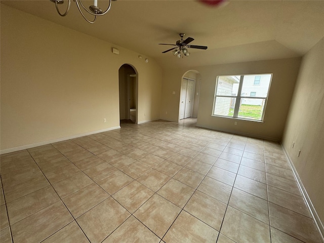 tiled empty room featuring ceiling fan