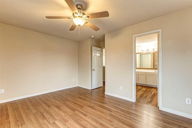 unfurnished bedroom with ceiling fan, connected bathroom, and light hardwood / wood-style flooring