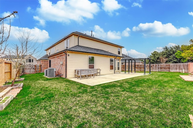 rear view of property with a pergola, a yard, cooling unit, and a patio area