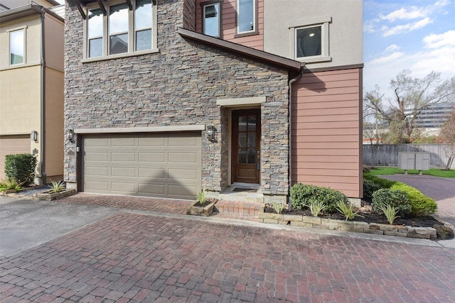 view of exterior entry with a garage