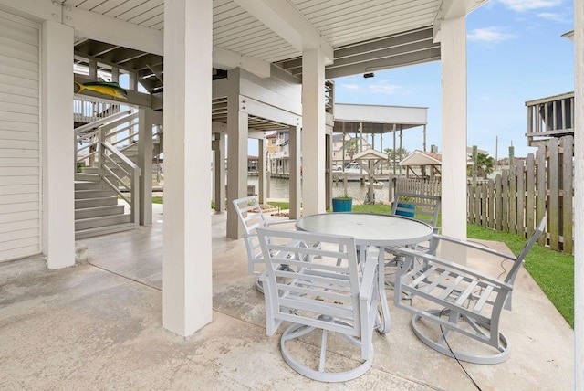 view of patio featuring a water view