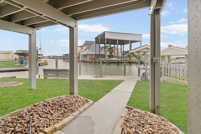 view of patio featuring a dock and a water view