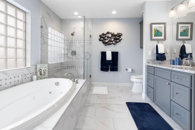 full bathroom featuring separate shower and tub, vanity, and toilet