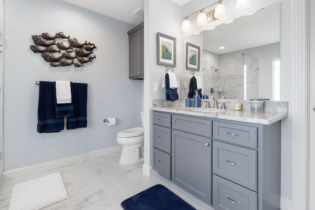 bathroom featuring vanity, toilet, and walk in shower