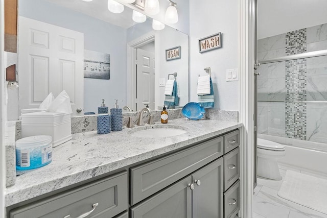 full bathroom featuring toilet, vanity, and bath / shower combo with glass door