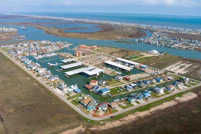 birds eye view of property featuring a water view