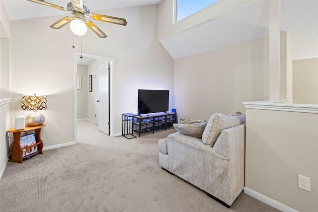 living room featuring light carpet, ceiling fan, and a high ceiling