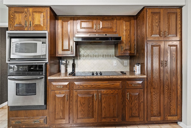 kitchen featuring tasteful backsplash and appliances with stainless steel finishes