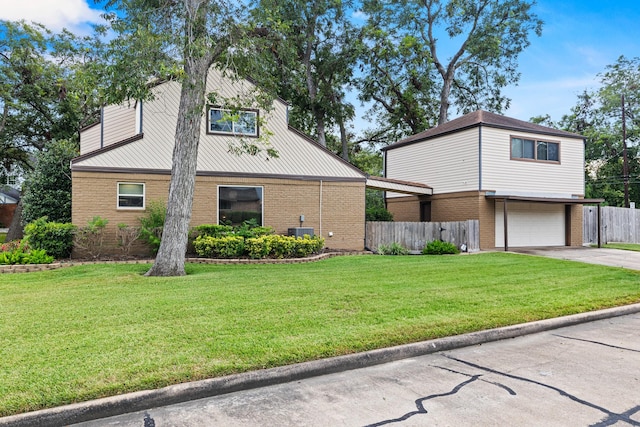 view of side of property with cooling unit, a yard, and a garage