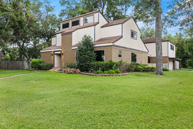 view of side of property featuring a lawn