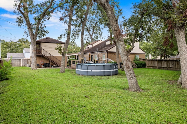 view of yard featuring a pool side deck