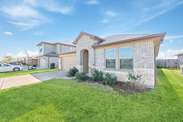 view of front of property with a garage and a front yard