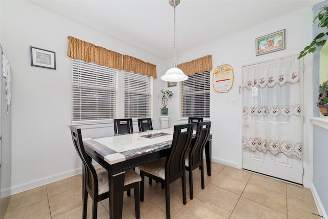 dining room with light tile patterned flooring