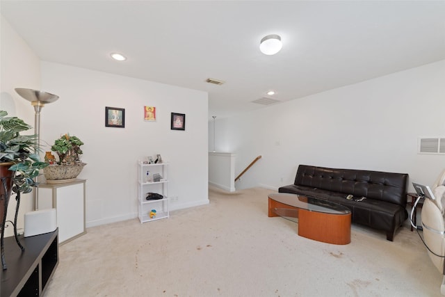 living area with light colored carpet