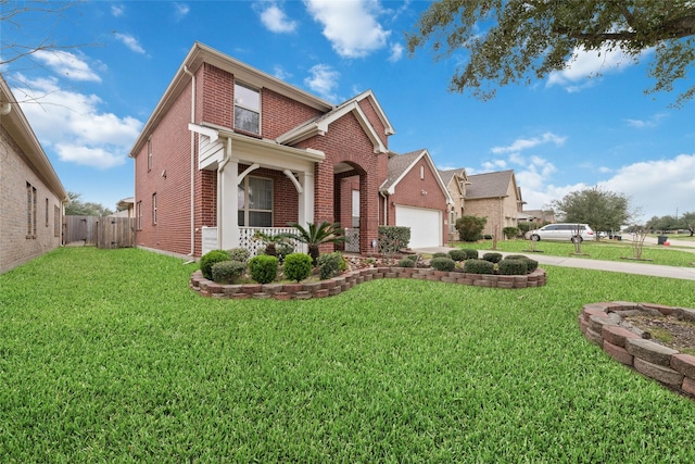 view of front of property with a garage and a front lawn