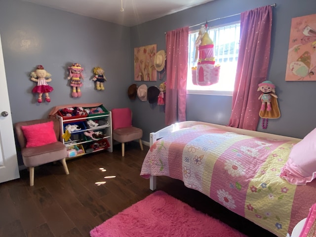 bedroom featuring dark hardwood / wood-style flooring