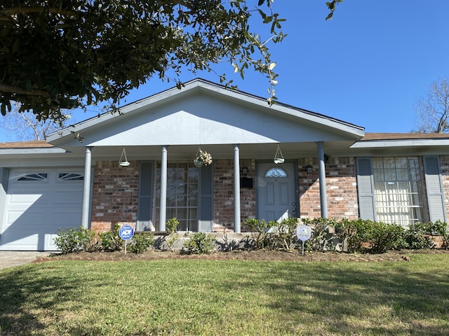 ranch-style house with a garage, a front yard, and a porch