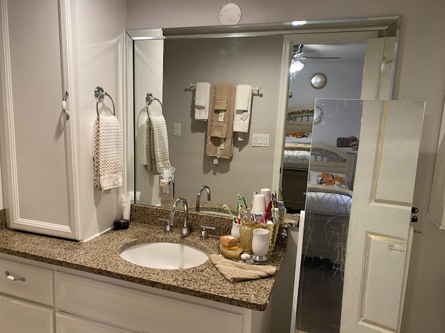 bathroom with ceiling fan and vanity