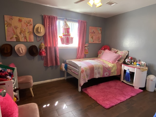 bedroom featuring dark hardwood / wood-style flooring and ceiling fan