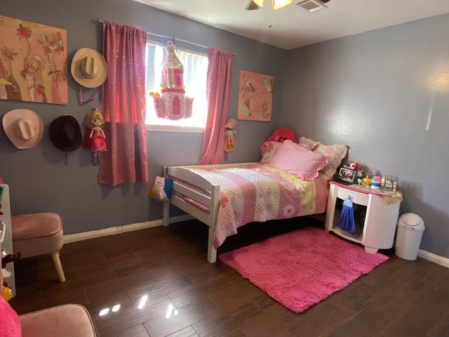 bedroom with ceiling fan and dark hardwood / wood-style flooring