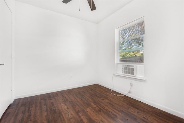 unfurnished room with dark hardwood / wood-style floors, cooling unit, and ceiling fan