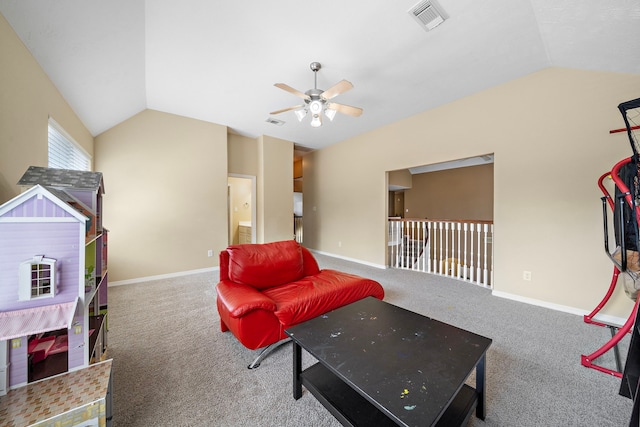 playroom with ceiling fan, carpet flooring, and vaulted ceiling