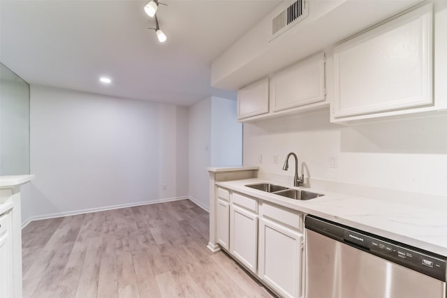 kitchen with white cabinetry, dishwasher, sink, and light hardwood / wood-style floors