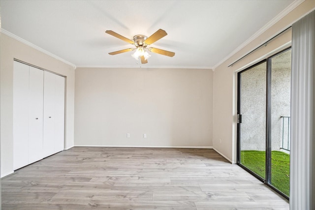 unfurnished bedroom featuring crown molding, multiple windows, and access to exterior