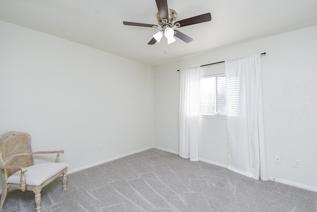 unfurnished room with ceiling fan, carpet flooring, and baseboards