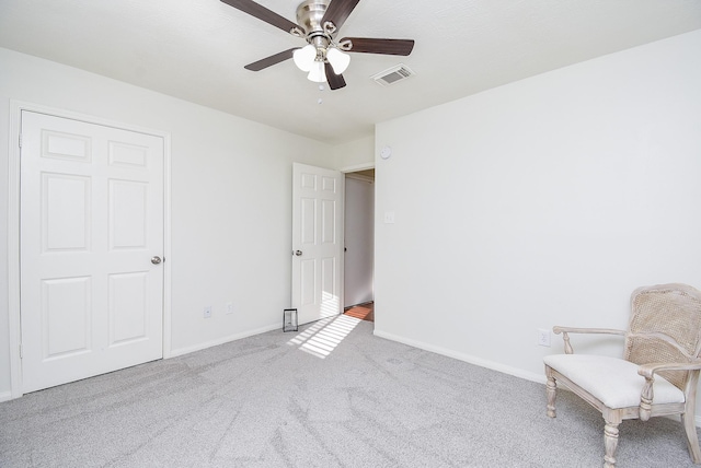 unfurnished bedroom with carpet floors, visible vents, ceiling fan, and baseboards